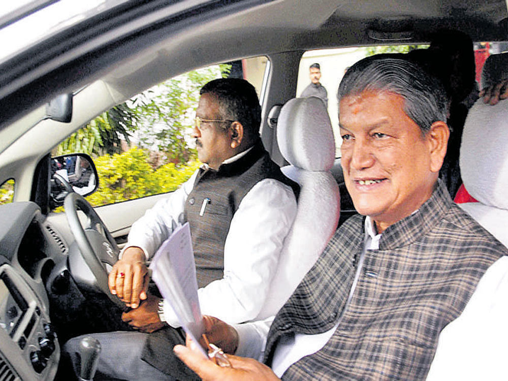 Harish Rawat leaves after submitting his resignation as chief  minister to the governor in Dehradun on Saturday. PTI