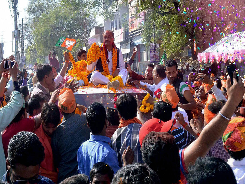 BJP leader Siddharth Nath Singh along with supporters taking part in a road show after his victory in Assembly elections in Allahabad on Saturday. PTI Photo