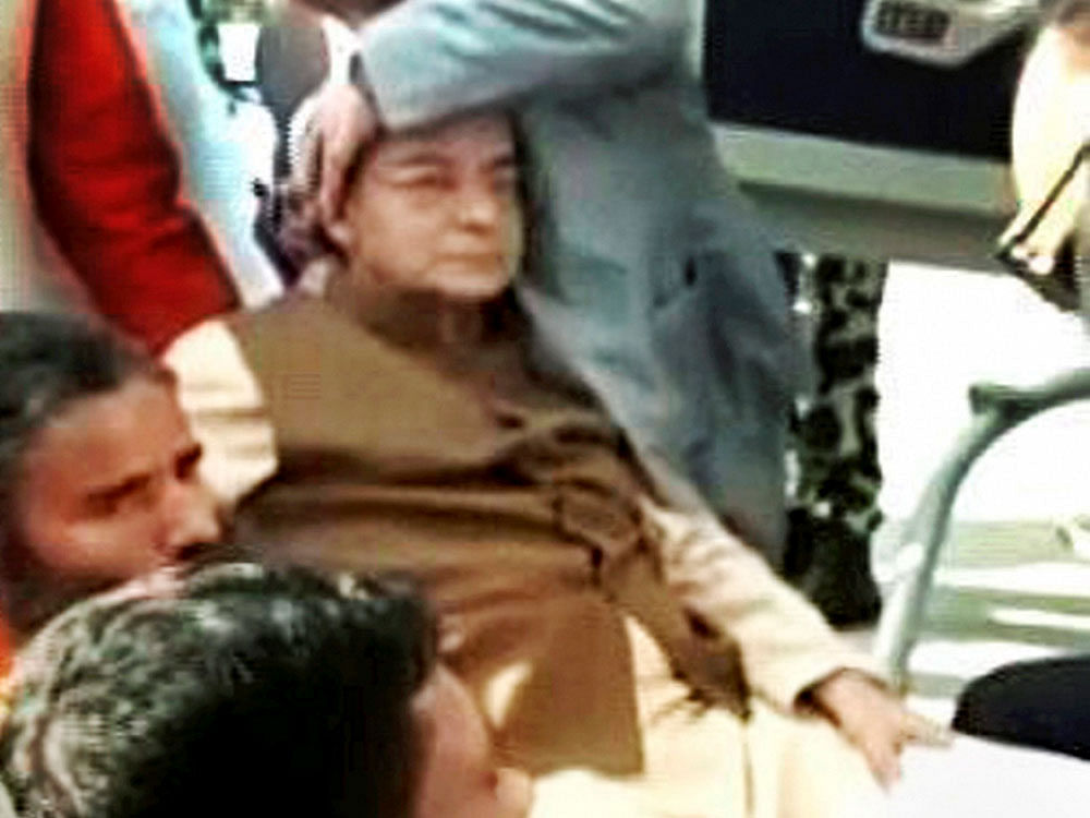Finance Minister Arun Jaitley being attended after he suffered a minor head injury as he slipped while boarding a chopper in Haridwar en route to Delhi, on Sunday. PTI TV/Grab