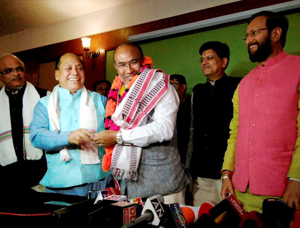 Nongthombam Biren Singh is greeted after he was elected at BJP legislature party leader in Imphal on Monday. Union Power Minister and BJP observer Piyush Goyal and HRD Minister Prakash Javadekar are also seen. PTI Photo