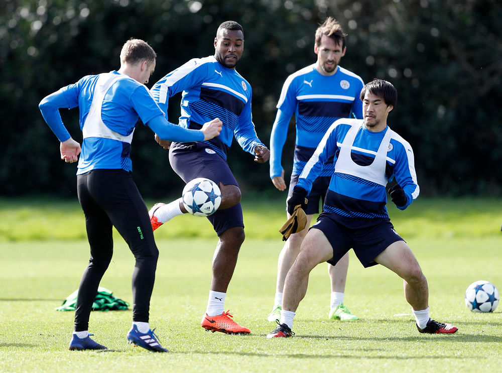 Leicester City's Shinji Okazaki, Jamie Vardy, Christian Fuchs and Wes Morgan during training. Reuters