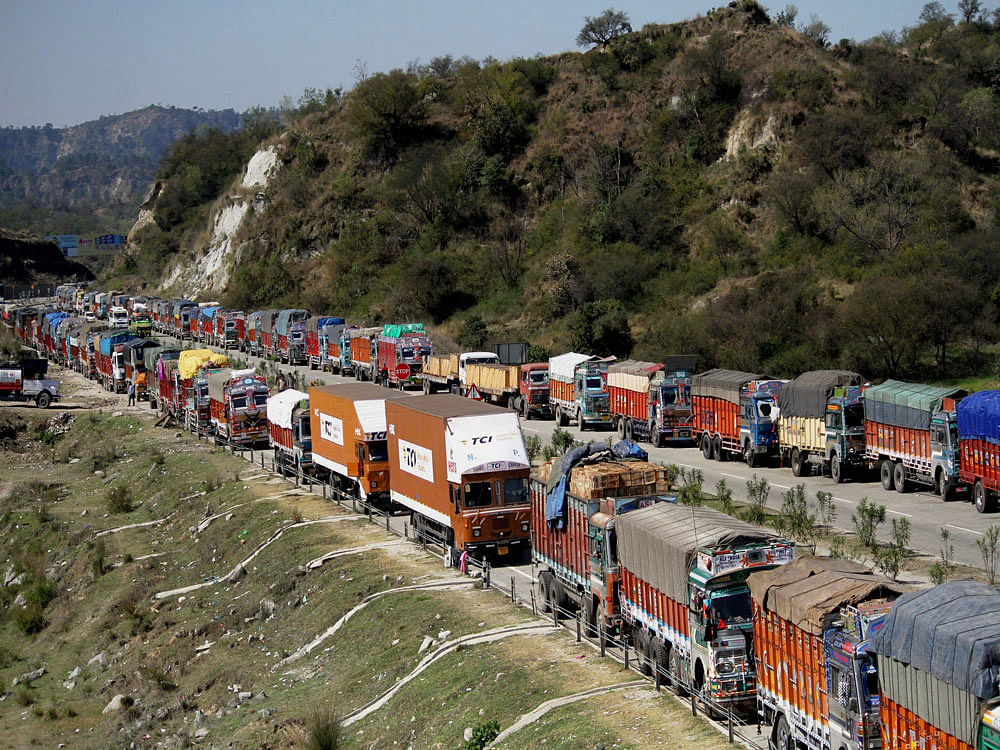 Stranded trucks on the Jammu-Srinagar National Highway that remained closed for the sixth consecutive day following landslides at different places on the road, in Jammu on Tuesday. PTI Photo