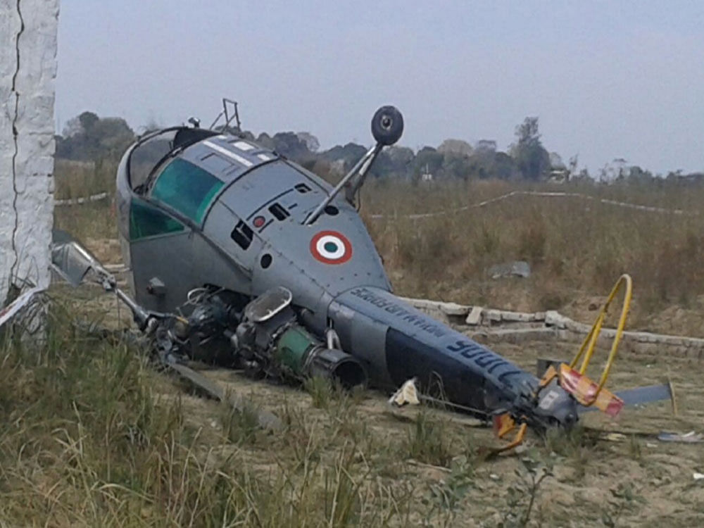 The chopper toppled when the pilots tried a forced landing after it developed a technical snag, sources in IAF said. Picture courtesy ANI
