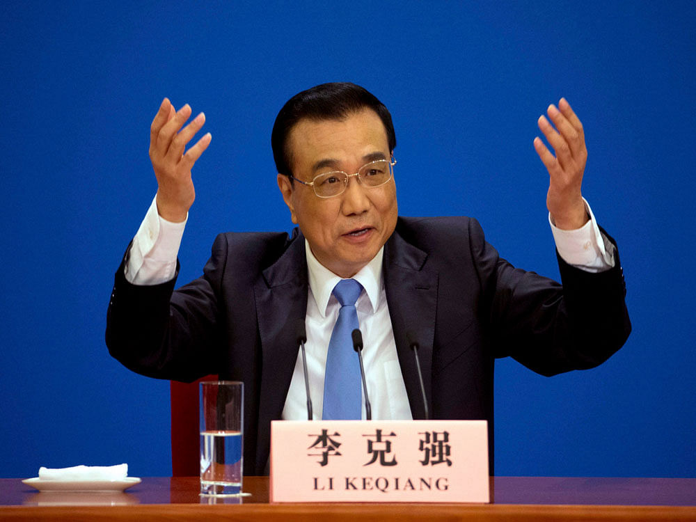 Chinese Premier Li Keqiang speaks at a press conference after the closing session of the National People's Congress in the Great Hall of the People in Beijing, China, Wednesday, March 15, 2017. China's No. 2 leader said Wednesday his government hopes for positive relations with Washington and has no desire for a trade war nor plans to devalue its currency to boost exports. Speaking at an annual news conference, Premier Li emphasized the shared interests of the world's two biggest economies. He said they should 'uphold strategic interests.AP/PTI