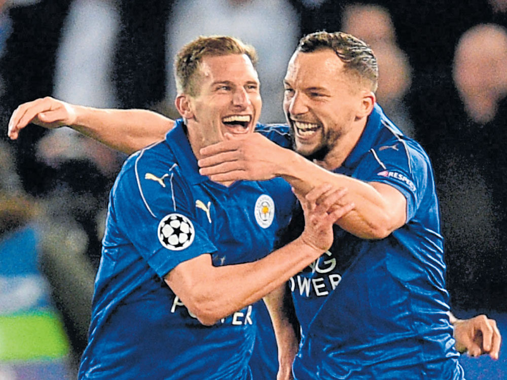 party time: Leicester City's Marc Albrighton (left) celebrates with Danny Drinkwater after scoring against Sevilla. AFP