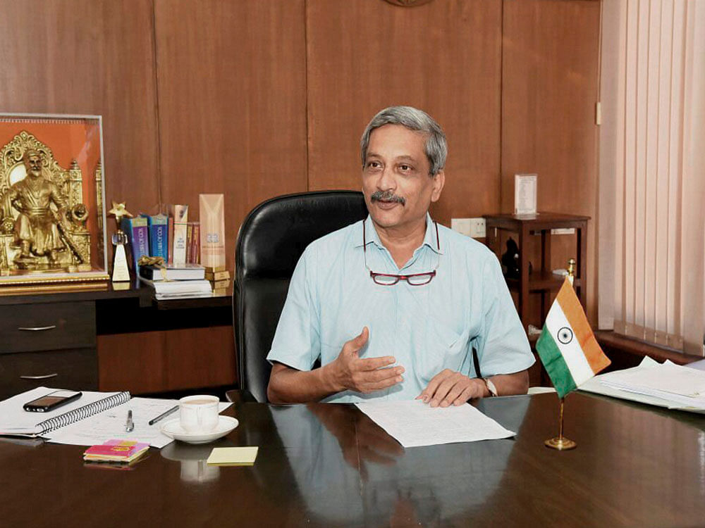 Goa Chief Minister Manohar Parrikar assumes charge of his office in Panaji on Wednesday. PTI Photo