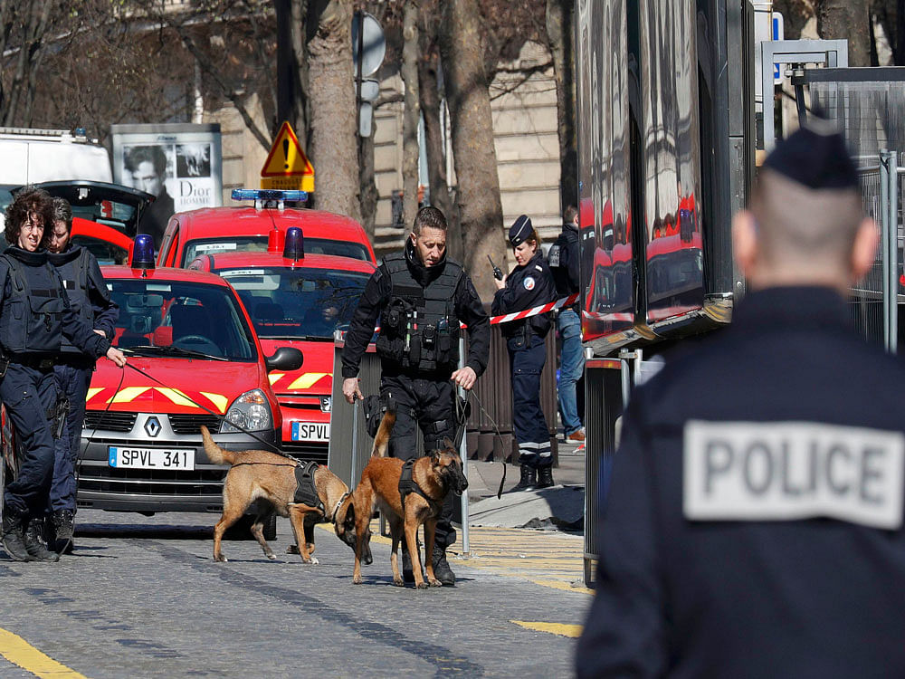 Police outside the International Monetary Fund (IMF) offices where an envelope exploded in Paris, France. Reuters Photo