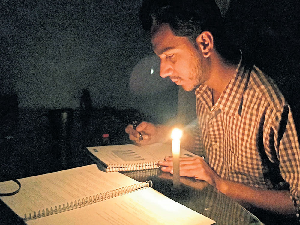 tough times With the power cuts becoming the order of the day, students like Ashhar  Kamaal (above) are finding it extremely difficult to prepare for exams.