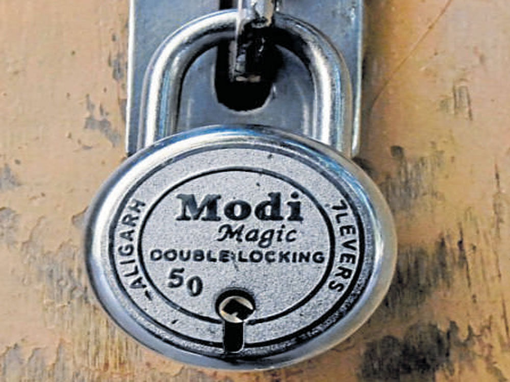 'Modi Magic Double Lock' used at outgoing minister Ravidas Mehrotra's government bungalow on Friday. PTI