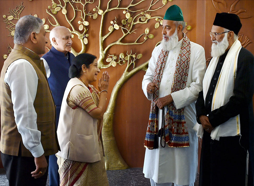 External Affairs Minister Sushma Swaraj with Syed Asif Nizami, the head priest of Hazrat Nizamuddin Aulia Dargah, and his nephew Nazim Ali Nizami, who went missing in Pakistan last week, after a meeting at Jawaharlal Bhawan in New Delhi on Monday. MoSes for External Affairs V K Singh and MJ Akbar are also seen. PTI Photo