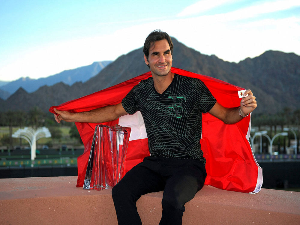 CHAMPION: Switzerland's Roger Federer with the Indian Wells title on Sunday. Swiss ace beat Stan Wawrinka 6-4, 7-5 in the final. PTI photo