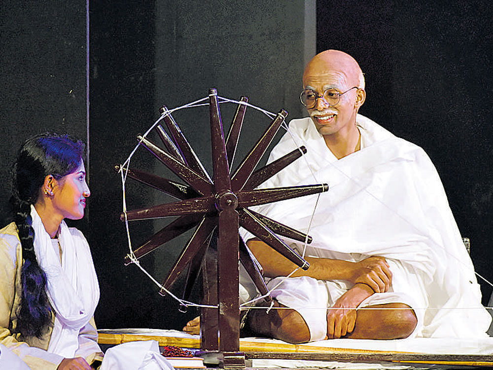 A scene from the play 'Yugapurusha-Mahatmara Mahatma,' which was premiered in Kannada on Tuesday. dh photo