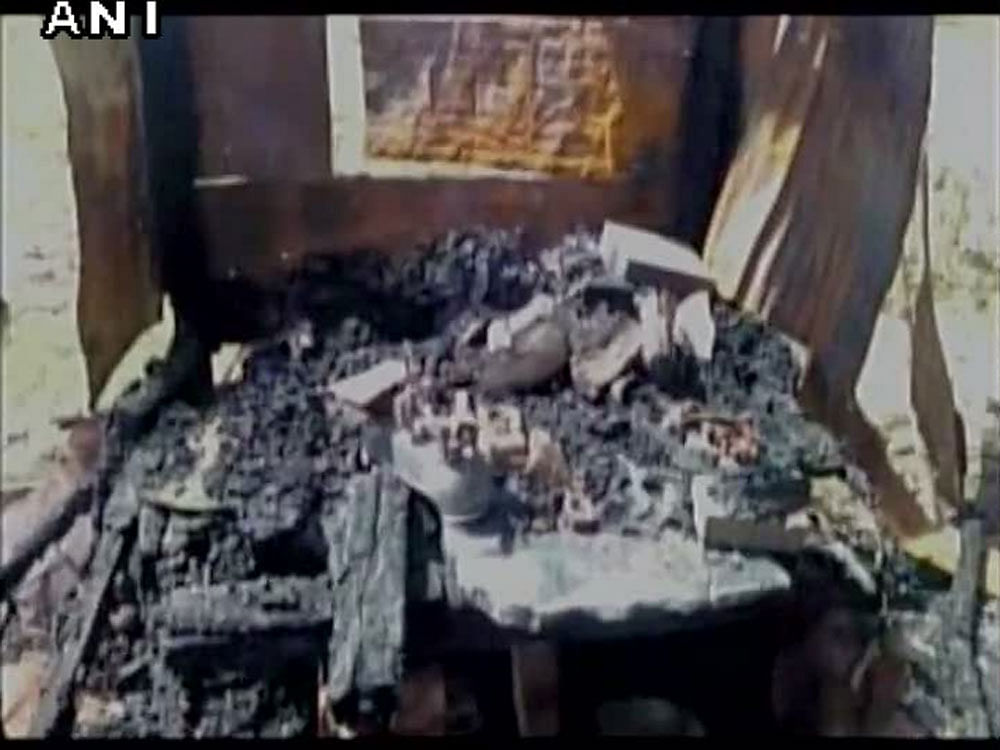 Three shops selling meat and fish were set afire by unidentified persons here, triggering panic in the area, police said today.  Picture courtesy ANI