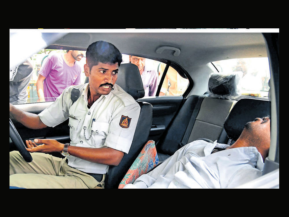 Yogesh, constable, and Rame Gowda, head constable, both attached to Chickpet traffic police station, heard the sound of the car crashing into the divider. The men on duty assumed the driver was on his mobile phone and hit the divider.