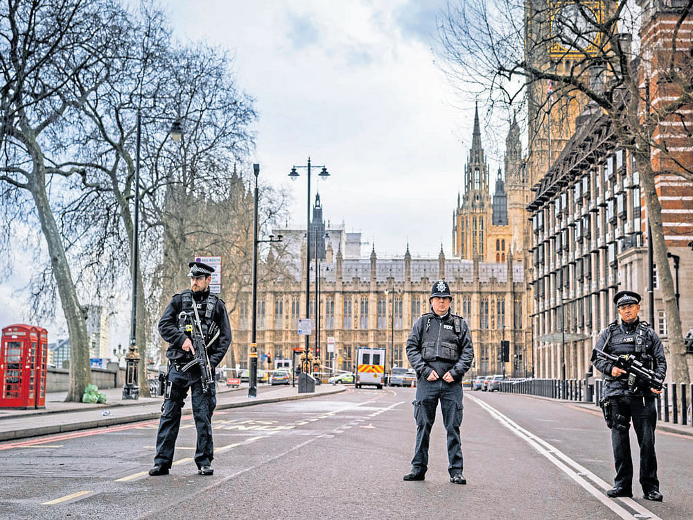 constant vigilance: Police officers secure the area near the houses of Parliament in London. Europeans seem hardened to terrorist attacks like this one - unsophisticated, the death toll relatively small and a far cry from the organised mayhem perpetrated in Paris in 2015.  nyt