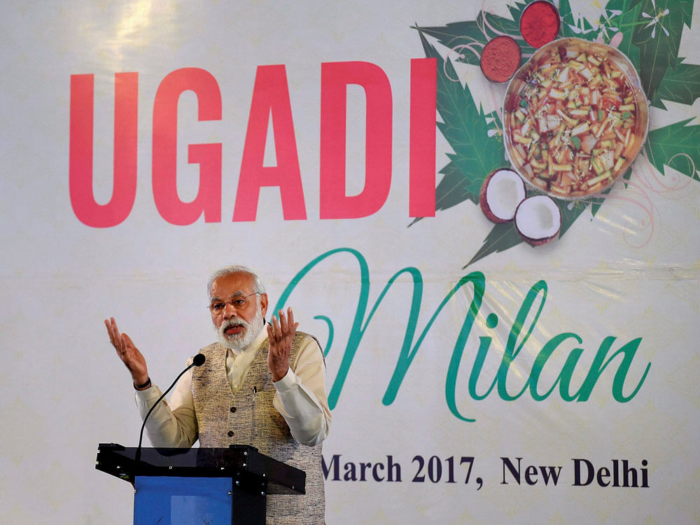 Prime Minister Narendra Modi addresses an event organised at the residence of Union I & B Minister M Venkaiah Naidu on the occasion of Telugu New Year 'Ugadi' in New Delhi on Sunday. PTI Photo