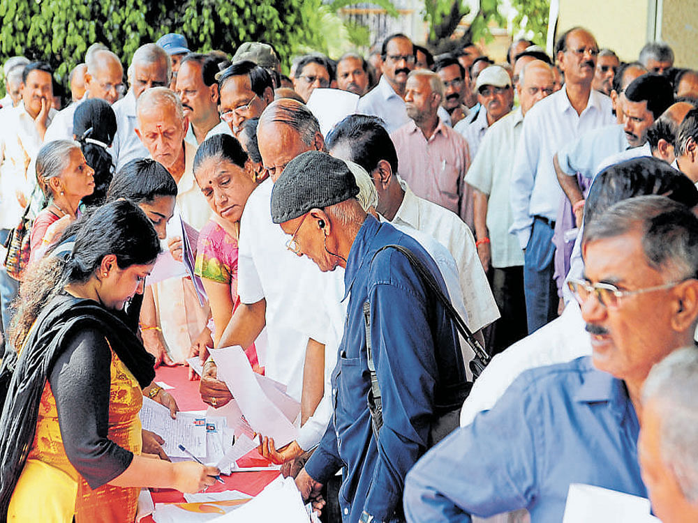 Senior citizens register for the job fair in the city on Sunday. DH PHOTO