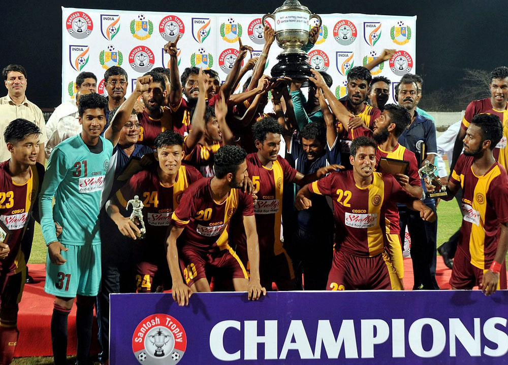 Ecstatic: West Bengal team pose with 71st Edition of Satnosh trophy after defeated Goa 1-0 in Bambolim in Goa on Sunday. PTI Photo