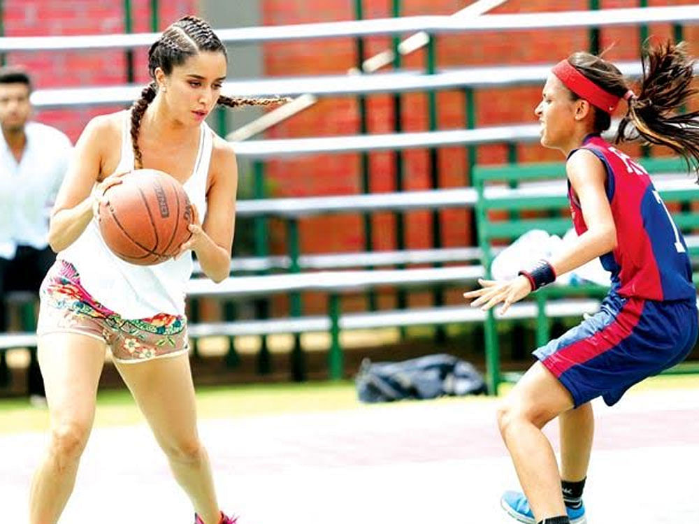 Bhagat took to Twitter where he posted an exclusive still of the actress from the movie playing basketball with full concentration.