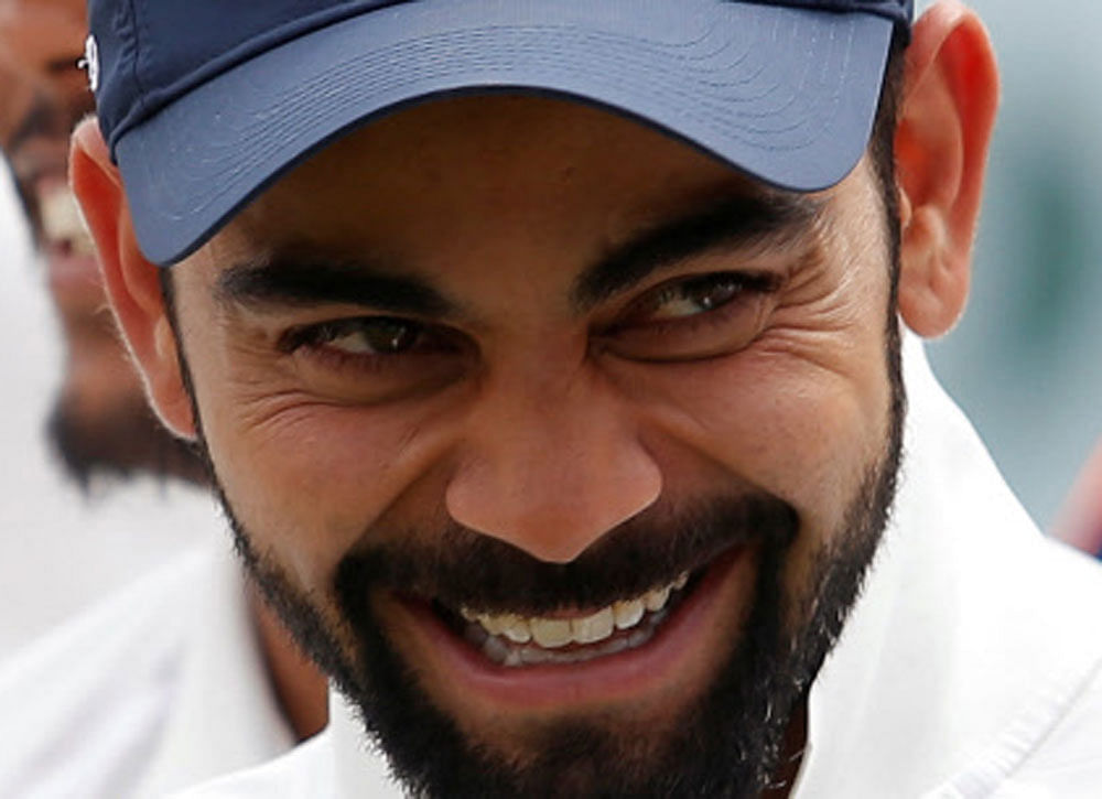 India's Virat Kohli laughs during an award ceremony after winning the series. REUTERS