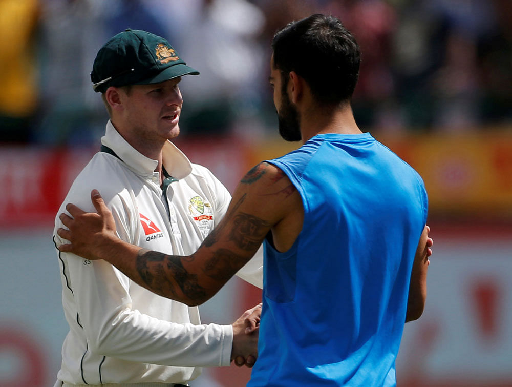 India's Virat Kohli (R) shakes hands with Australia's captain Steven Smith after India won the series. REUTERS Photo