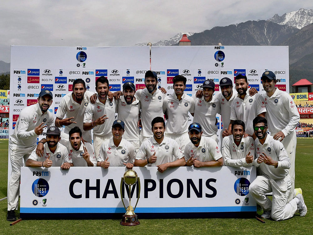Indian team poses with the Border Gavaskar trophy after winning the series against Australia on the 4th day of fourth test match at HPCA Stadium in Dharamsala on Tuesday. PTI Photo