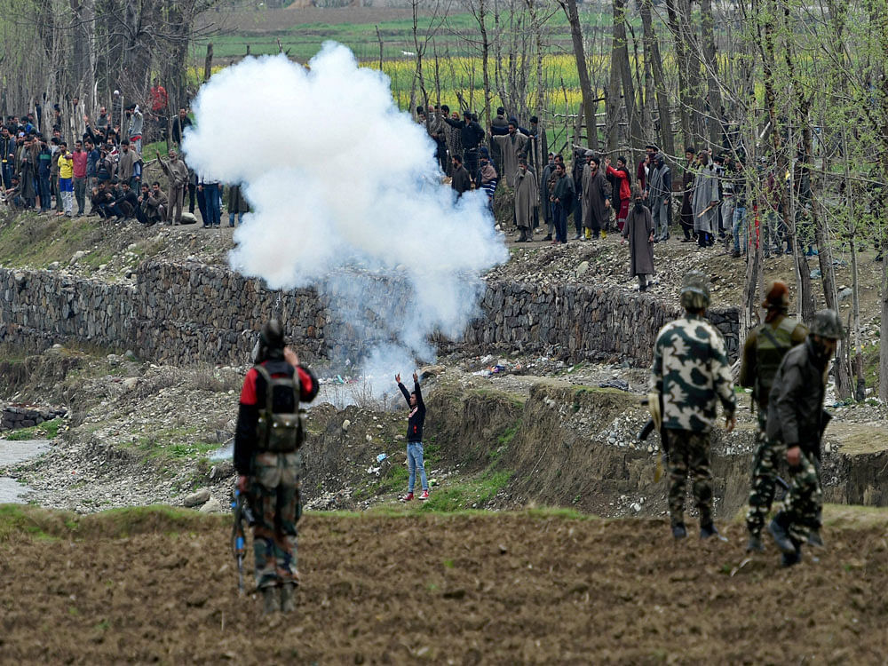 Local protesters try to disrupt an anti-militant operation at village Durbugh in Chadoora area of central Kashmir's Budgam district on Tuesday. One militant and three civilians were killed in the operation. PTI photo
