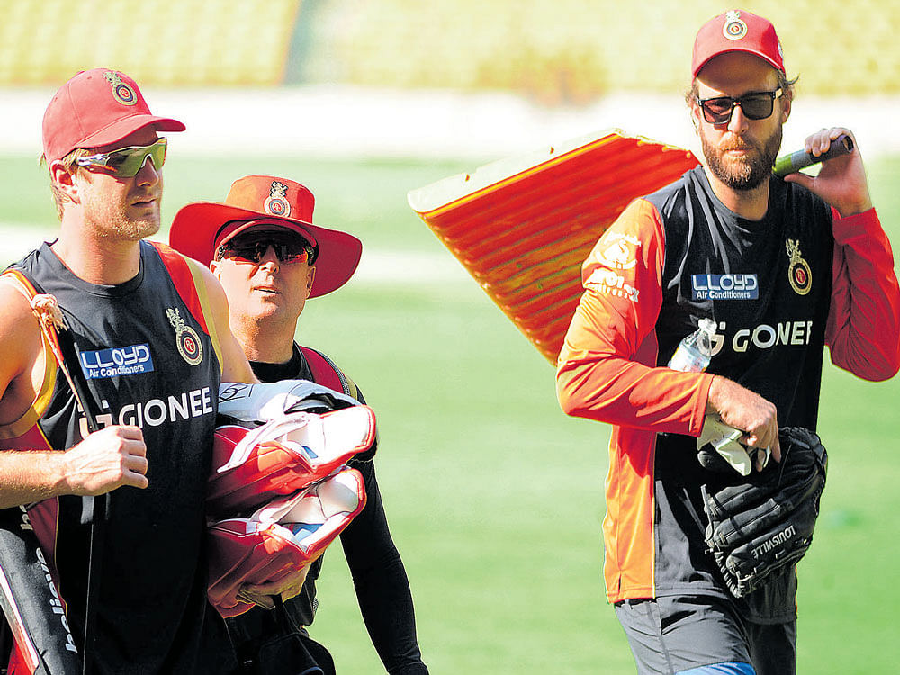 Royal Challengers Bangalore's Aussie all-rounder Shane Watson (from left), batting coach Trent Woodhill and coach Daniel Vettori after team's first practice session in Bengaluru on Thursday. dh photo/ srikanta sharma r