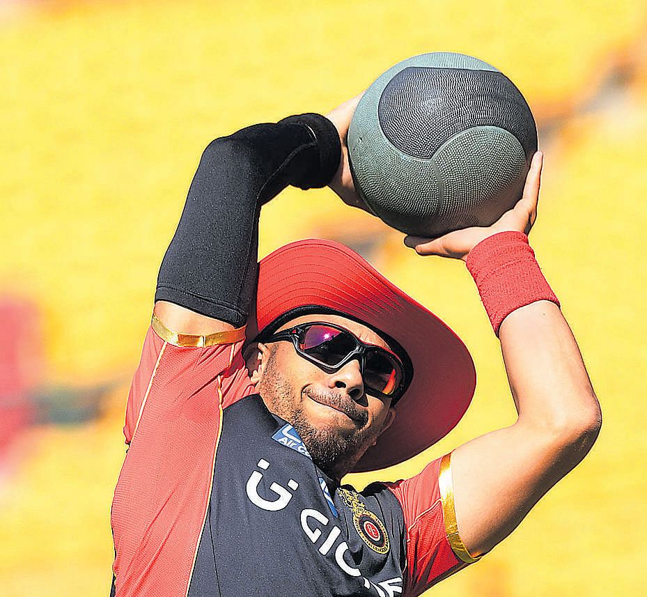 set for the battle Royal Challengers Bangalore's new acquisition Tymal&#8200;Mills stretches during a training session on Friday. DH photo/ kishor kumar  BOLAR