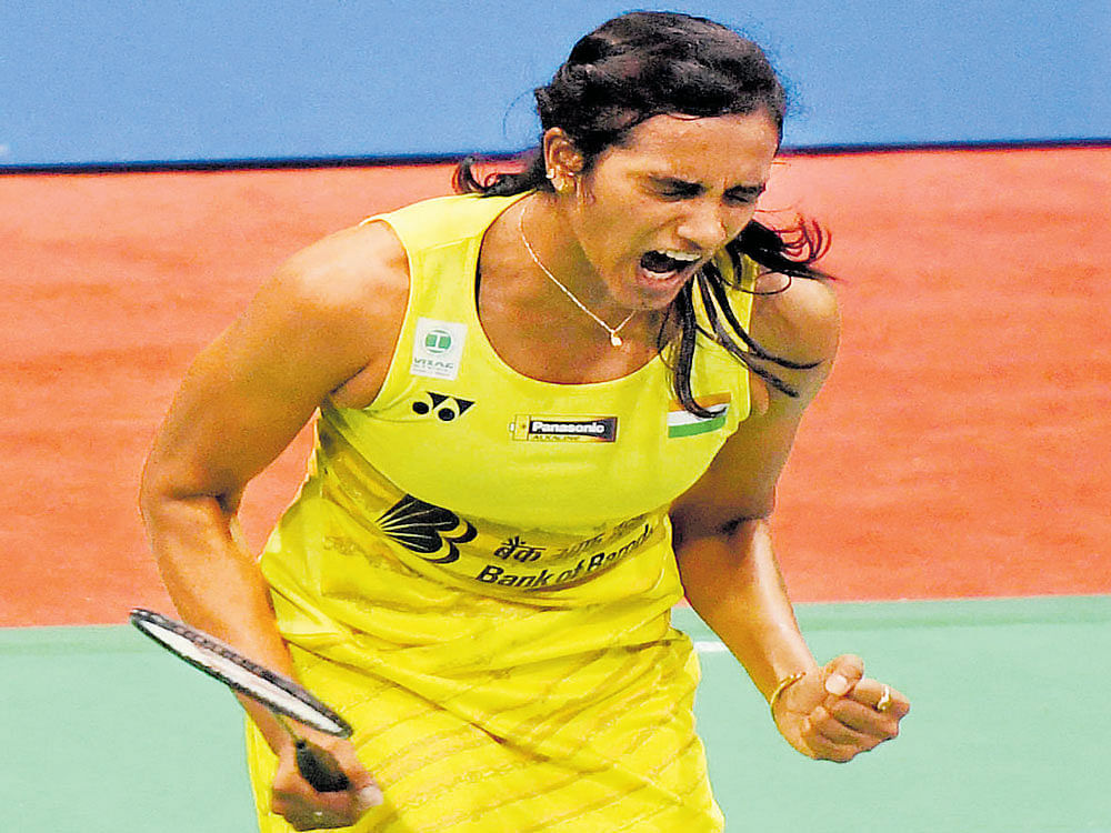 War cry: India's PV Sindhu is ecstatic after beating Saina Nehwal in their quarterfinal clash of the India Open Superseries event in New Delhi on Friday. PTI