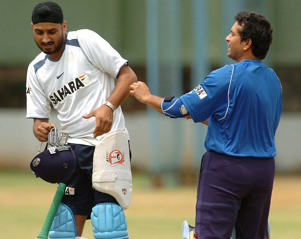 File photo Harbhajan Singh and Sachin Tendulkar during a practice session in Chinnaswamy Stadium, Bengaluru.