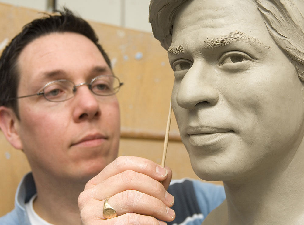 Captured in true form: Principal sculpture artist Stephen Mansfield working on Shahrukh Khan's wax statue.