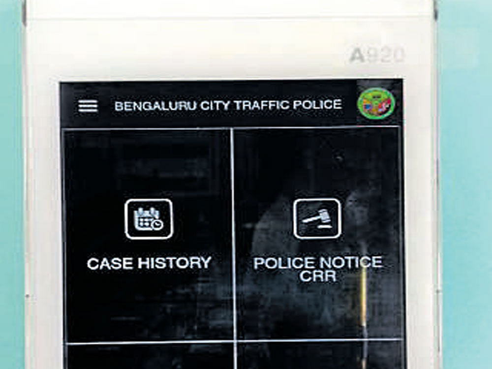 A&#8200;smart mobile tablet terminal through which fines for traffic offences can be paid by credit and debit cards.