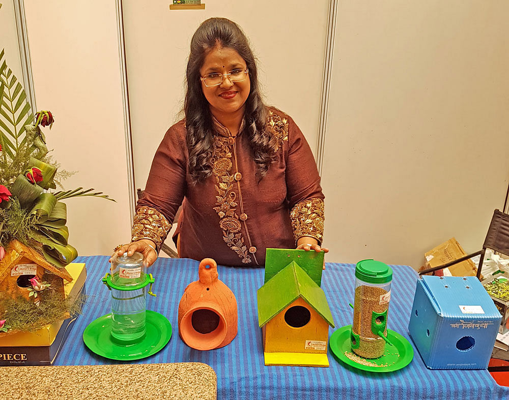 Neelam Agarwal with specially designed nests for sparrow.