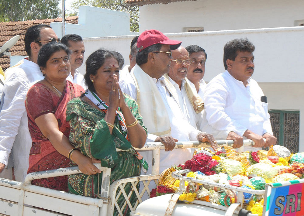 Chief Minister Siddaramaiah campaigns for Congress candidate Geetha Mahadev Prasad at Kuthanuru village, Gundlupet taluk, in Chamarajanagar district on Saturday. Siddaramaiah's son Dr Yathindra, C M Ibrahim, Minister for Irrigation M B Patil and others are seen.