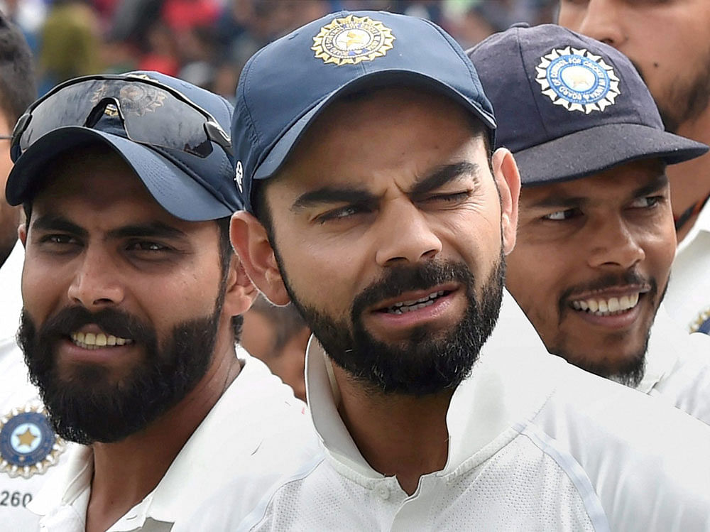Super show: Skipper Virat Kohli (centre) found strong support from Ravindra Jadeja (left) and Umesh Yadav  en route to another series win, this time against Australia. PTI