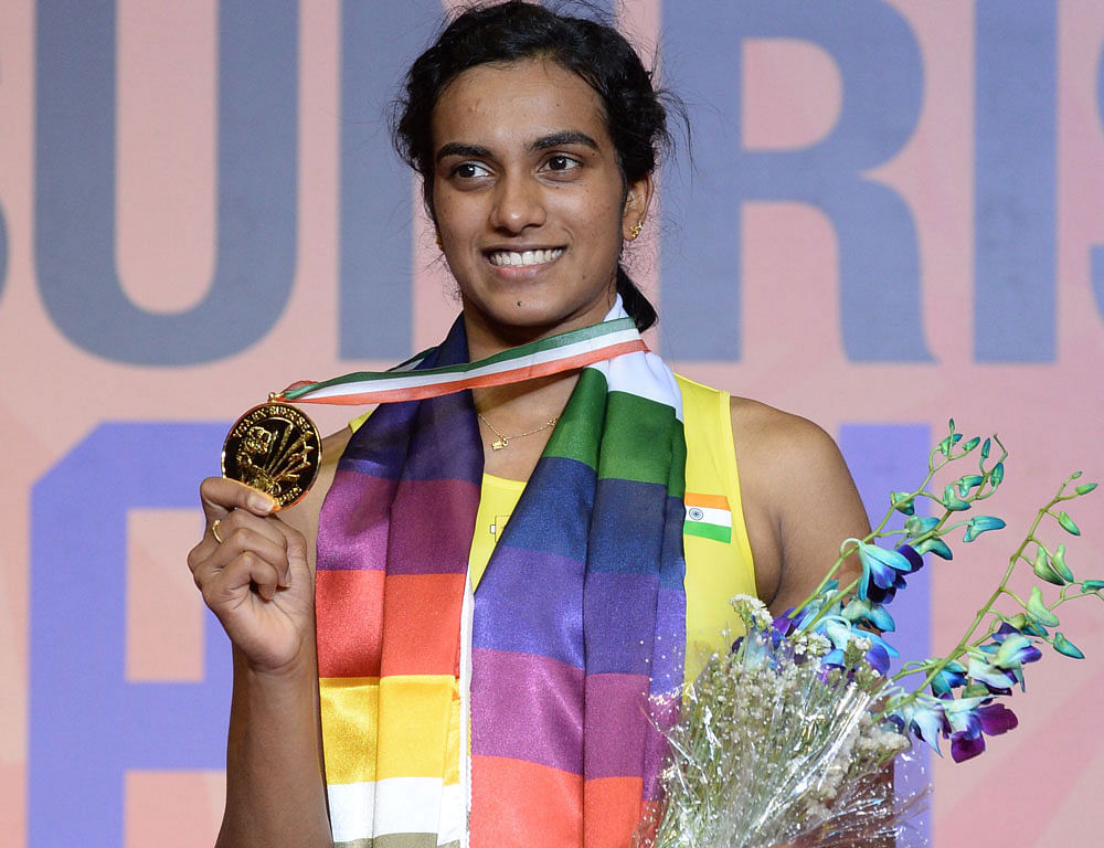Champion: India's PV Sindhu flashes her winner's medal at the India Open on Sunday. PTI