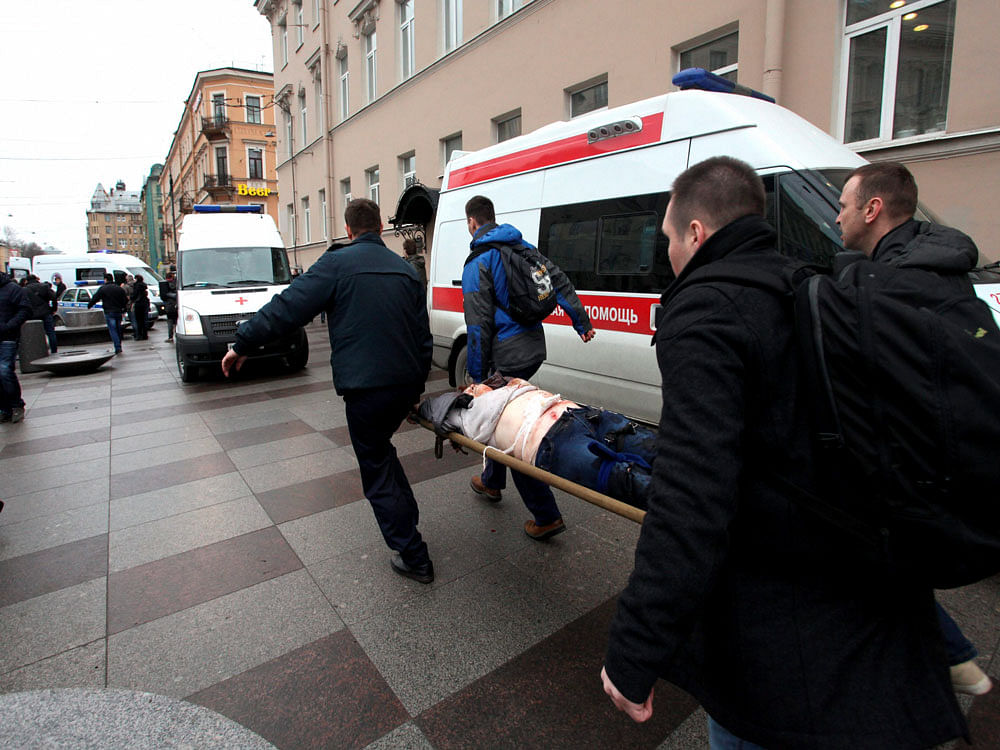 People carrie a subway blast victim into an ambulance after explosion at Tekhnologichesky Institut subway station in St.Petersburg, Russia. AP/PTI