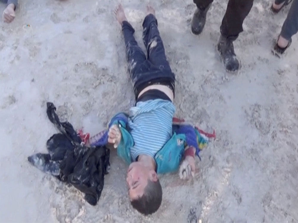 A still image taken from a video posted to a social media website on April 4, 2017, shows a boy lying on the ground said to be in the town of Khan Sheikhoun, after what rescue workers described as a suspected gas attack in rebel-held Idlib. Reuters photo
