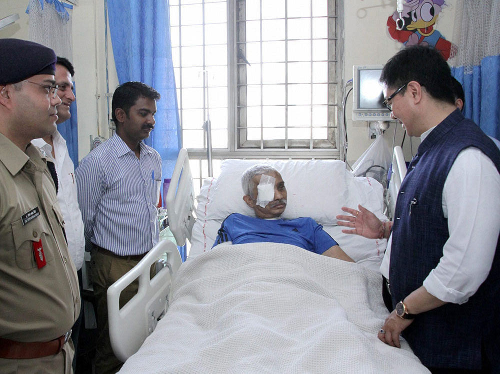 Minister of State for Home Affairs, Kiren Rijiju seeing the CRPF Commandant, Chetan Kumar Cheetah at AIIMS, who survived fatal bullet injuries in an encounter in Jammu and Kashmir in February this year, in New Delhi on Wednesday. PTI Photo/PIB