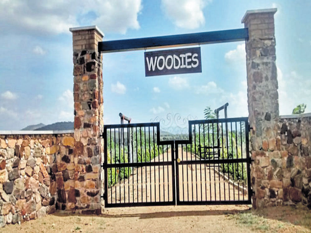 The entrance of Woodies, a resort and gated community.