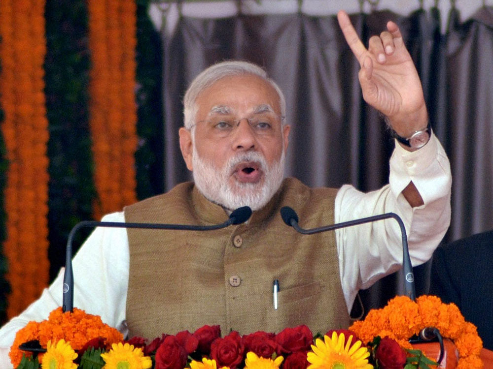 'Corruption and black money have destroyed the Indian democracy, eating into it like a termite. But due to your blessings, the fight against corruption and black money will continue,' Modi said here. PTI file photo