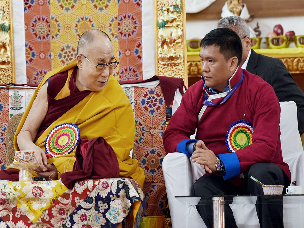 Tibetan spiritual leader the Dalai Lama (L) talking to Arunachal Pradesh CM Pema Khandu at the Thupsung Dhargyeling Monastery in Dirang, Arunachal Pradesh on Thursday. PTI Photo