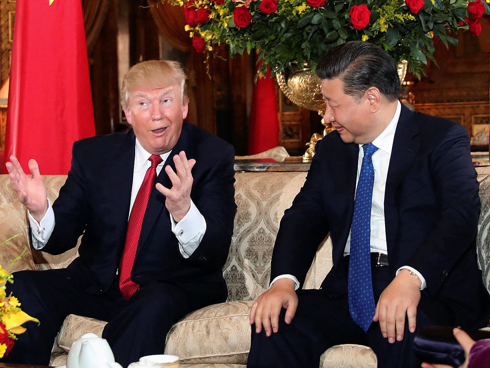 U.S. President Donald Trump interacts with Chinese President Xi Jinping at Mar-a-Lago state in Palm Beach, Florida. Reuters photo
