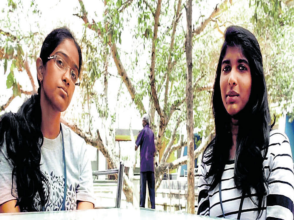 Shravanya R and Divya S Hegde, students of R V College of Engineering and designers of smart bins. DH photo