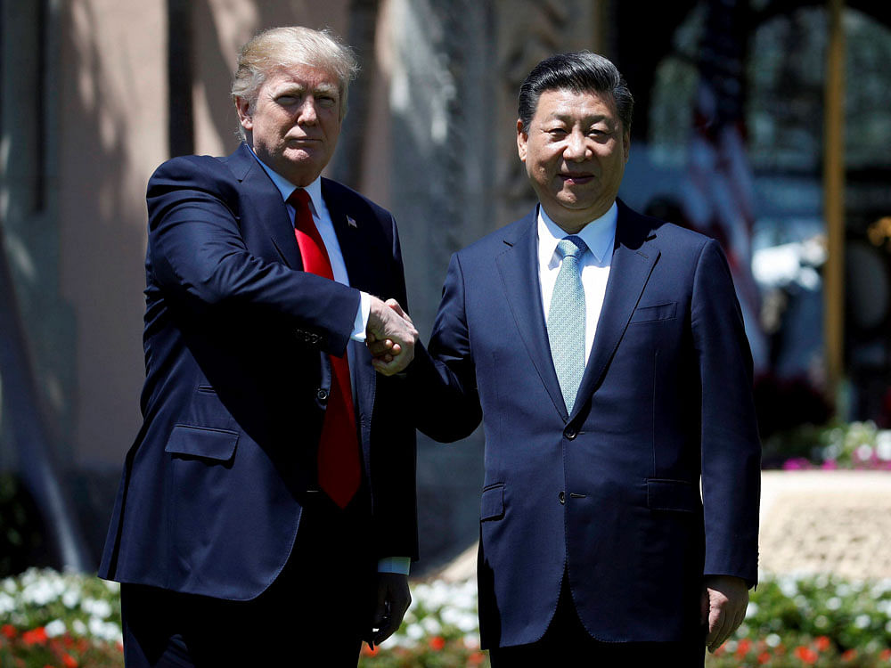 President Donald Trump and Chinese President Xi Jinping shake hands after a bilateral meeting at Mar-a-Lago, Friday, April 7, 2017, in Palm Beach, Fla. Trump was meeting again with his Chinese counterpart Friday, with U.S. missile strikes on Syria adding weight to his threat to act unilaterally against the nuclear weapons program of China's ally, North Korea. AP/PTI