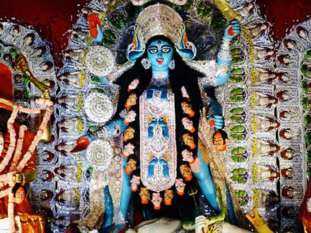 Woman decapitated before Kali idol. Representative image