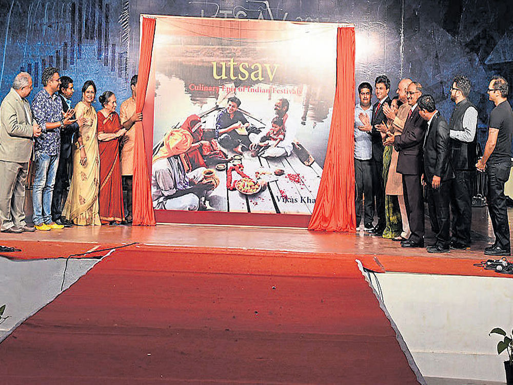 Chef Vikas Khanna and others unveil the cover of 'Utsav', a Culinary Epic of Indian Festivals,' in Manipal.