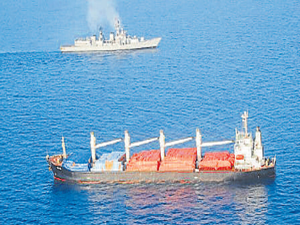 Destroyer INS Mumbai and the pirated vessel. DH photo