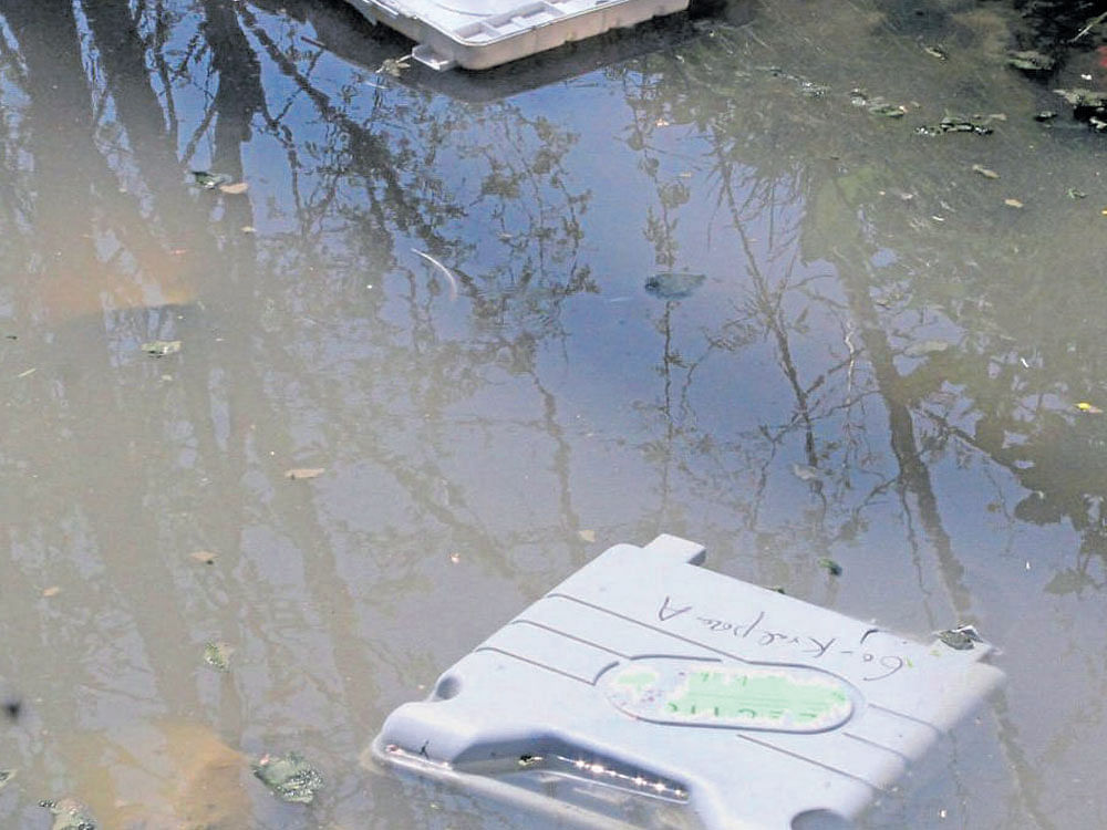 Protesters threw electronic voting machines into a river at Kanihamma. PTI